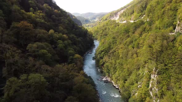 Aerial view from a drone on a road in the mountains.