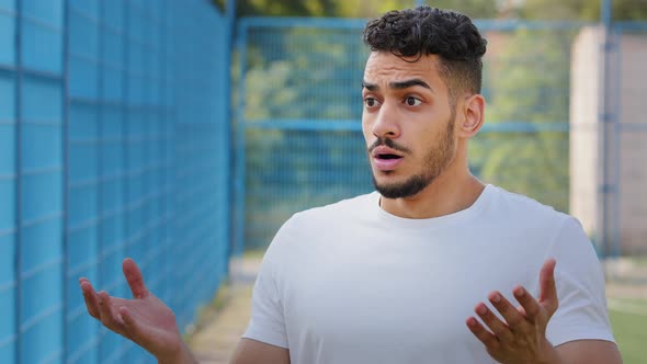 Afraid Surprised Indignant Middle Eastern Arab Athlete in Summer Sportswear Frantically Gesturing