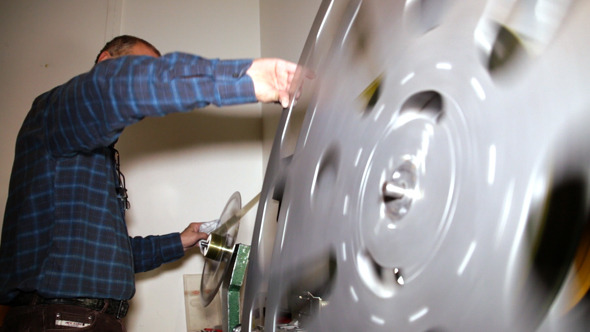 Film Technician Rewinding 35mm Film