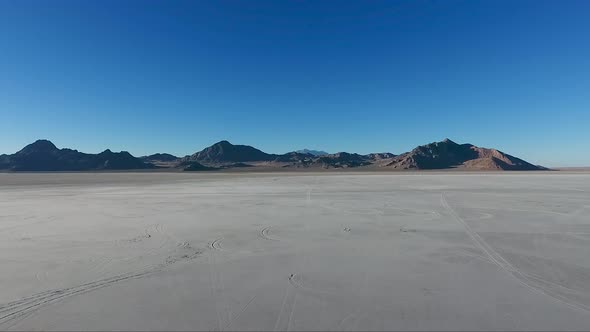 Flying over the Bonneville Salt Flats in Northwestern Utah reveal white salt and tire tracks.