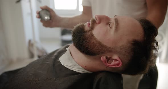 Barber Sets Hair By Spray and Combs Them