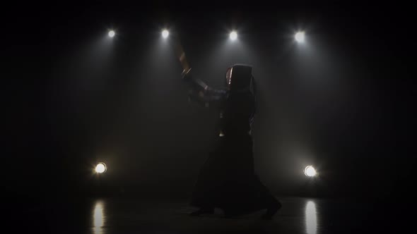 Kendo Fighter Practicing Martial Art with the Shinai Sword.