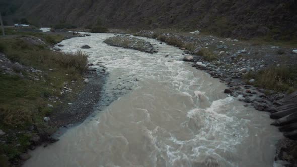 The Mountain River Flows Fast