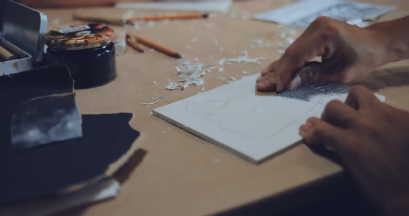 Male Artist Makes a Linocut