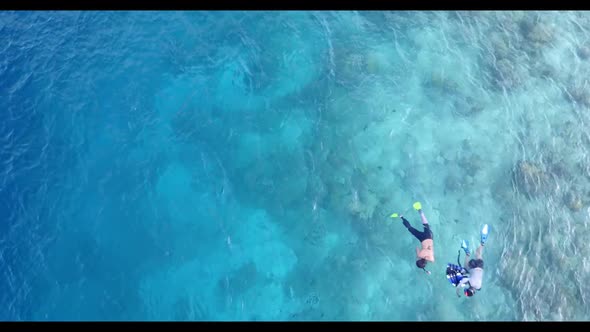 Romantic couple engaged on paradise lagoon beach break by blue lagoon with white sand background of 