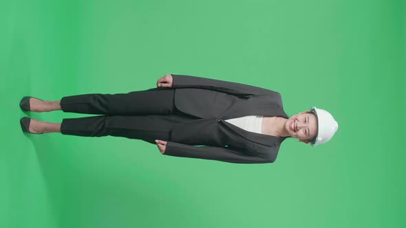 Full Body Of Asian Female Engineer With Safety Helmet Smiling In The Green Screen Studio