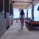 Back View Girl In Swimming Suit Walking Alone In Resort On Sunny Day Slow Motion - VideoHive Item for Sale