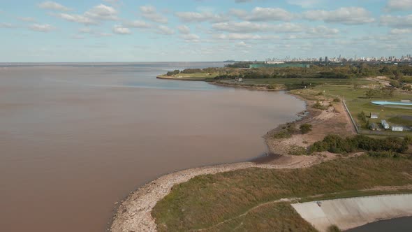 Aerial view of La Plata river coast at daytime, revealing Buenos Aires city in background