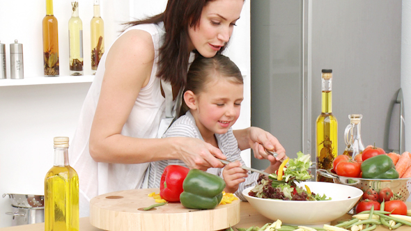 Mother and Daughter Preparing a Salad