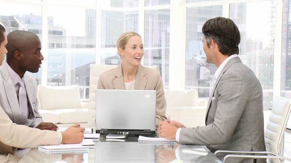 Smiling Business People in a Meeting