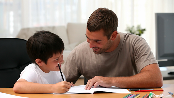 Father and Son Doing Homework