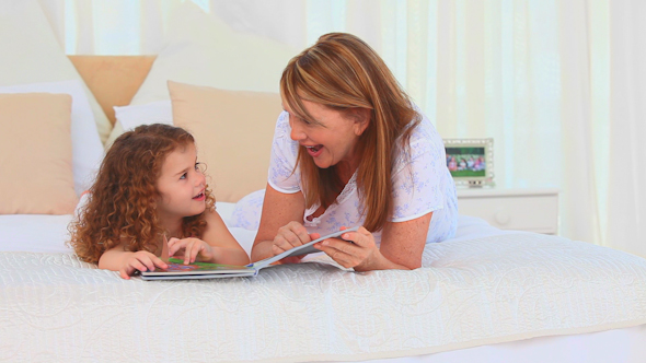 Lovely Lttle Girl Reading A Book