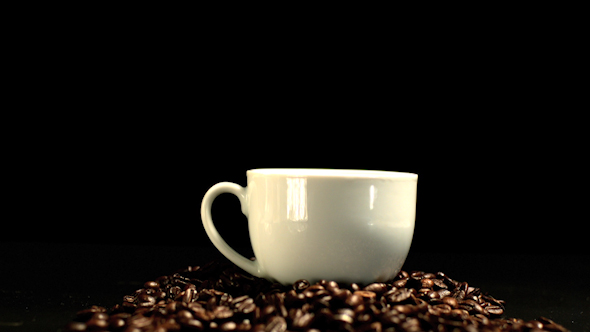 Sugar Cube Falling In Coffee Cup And Splashing