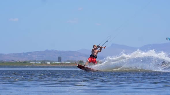 A man kiteboarding on a kite board.