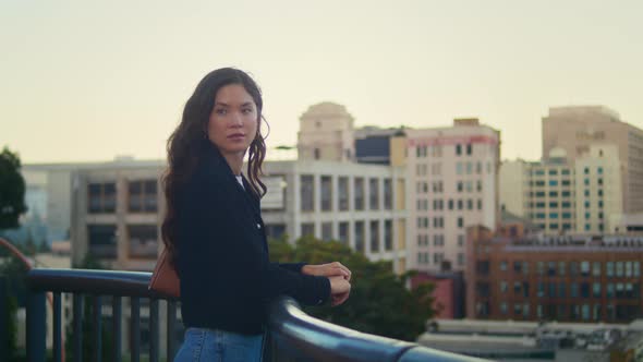 Beautiful Woman Standing Near City Railing