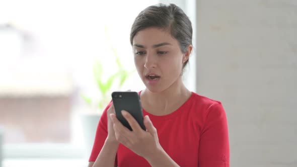 Upset Indian Woman Reacting to Loss on Smartphone