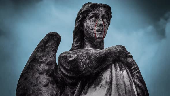 Video of statue crying blood on a rainy afternoon