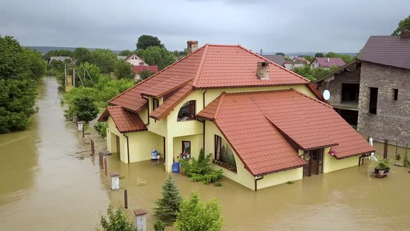 Aerial view of flooded houses with dirty water of Dnister river in Halych town, western Ukraine