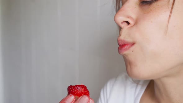 Young Sexy Woman Appetizing Eating Fresh Juicy Strawberry