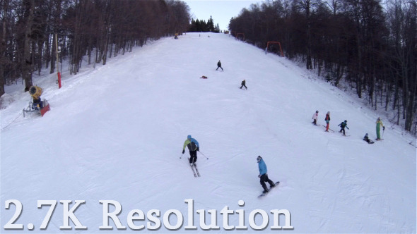 Flying over Winter Skier and Snowboarder