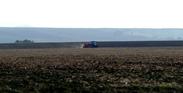 Plowing the Fields with a Tractor