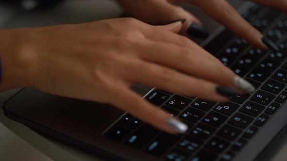 African American Woman Hand Typing Laptop Computer Keyboard in Business Office
