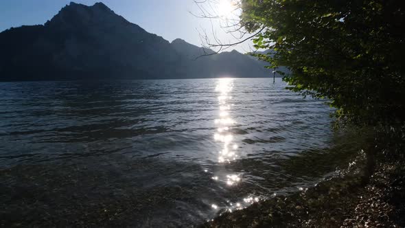 Traunsee lake, Upper Austria. Morning sunlight  blinking on water surface