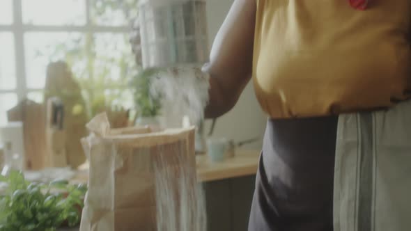 Woman Singing and Dancing while Cooking Food