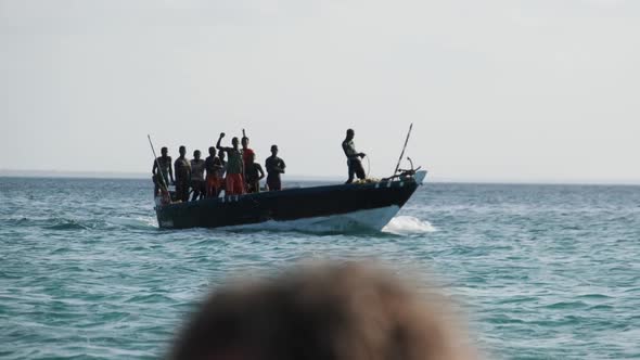 Funny Dancing African Fishermen on Wooden Motor Boat Floating By Ocean Africa