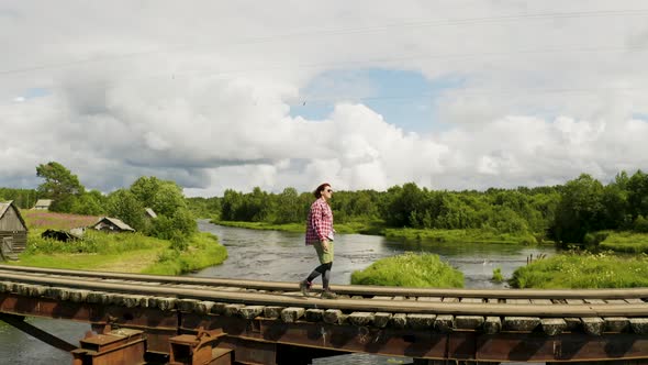 Girl Walking At Wooden Bridge