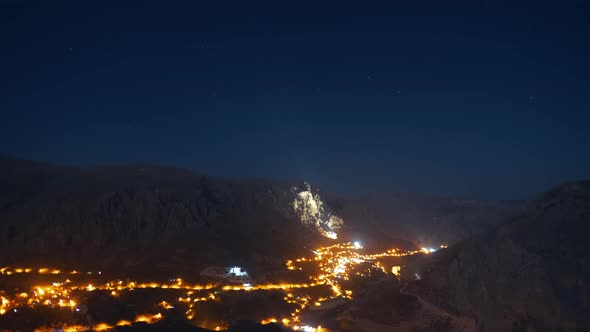 Time-Lapse View of Clouds in a Town