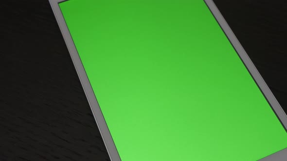 Green screen display on tablet PC  slow tilting 4K 2160p UHD footage - Greenscreen display on PC tab