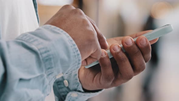 Closeup Male Hands of Unrecognizable African American Man Holding Telephone Typing Message Chatting