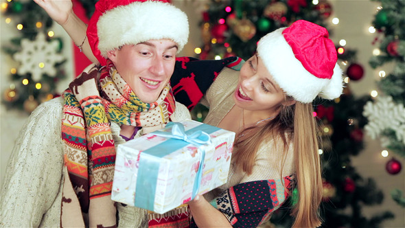 Loving Couple Hold Christmas Presents