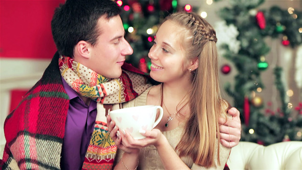 Young Beautiful Couple In Sweaters And Scarves
