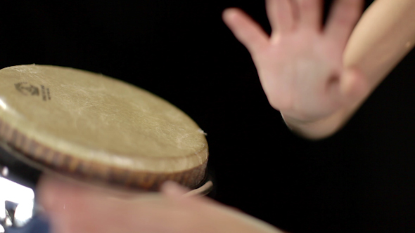 Beautiful Female Percussion Drummer Performing With Bongos