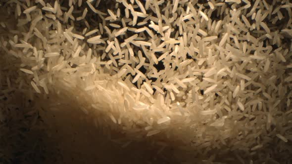 Rice Basmati Is Tossed In The Air On A Black Background