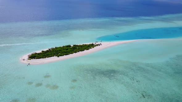 Drone view texture of resort beach by blue lagoon with sand background