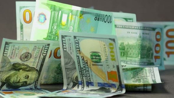 Falling Euro and Dollars Banknotes