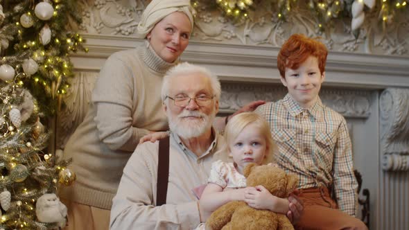 Portrait of Happy Grandparents and Kids on Christmas