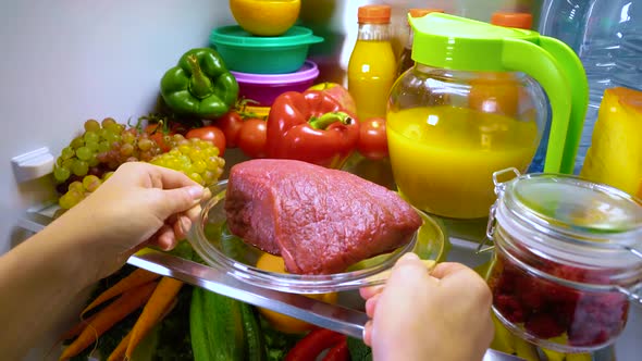 Fresh Raw Meat on a Shelf Open Refrigerator