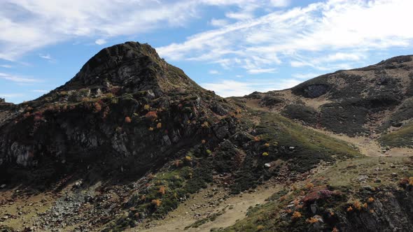 Drone Take Off Over the Mountains Flight Over Autumn Mountain with Forest Soft Light