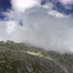 Low clouds cling to a mountain - VideoHive Item for Sale