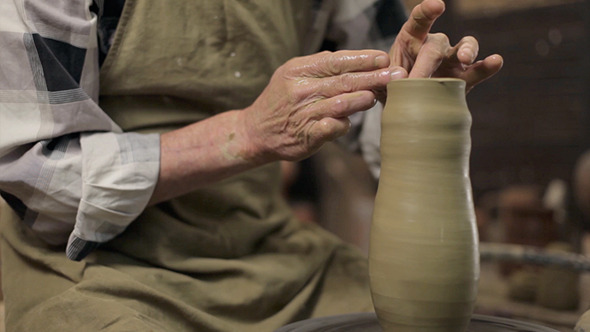 An Old Master Manufactoring A Vase From Clay
