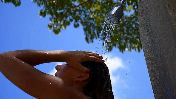 Woman Taking a Shower Outdoors