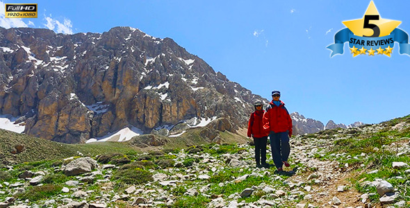 Woman Tracking Sticks Up on the Mountain, Hiking Trips in the Mountains