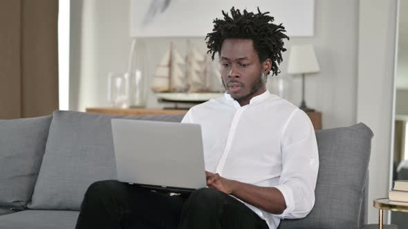 Hardworking African Man Having Wrist Pain at Home 