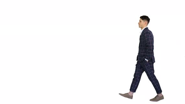 Young Cool Elegant Man Walking By on White Background.