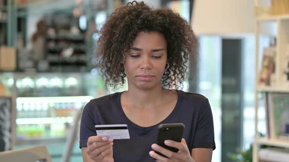 Portrait of Online Payment Failure on Smartphone By African Woman 