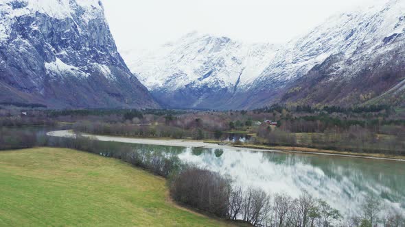 Asphalt Road By The Lake Water At The Feet Of Trollveggen Mountain In More og Romsdal County, Norway